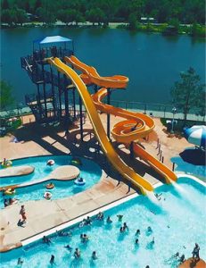 Image of Waterslides and People in Pool